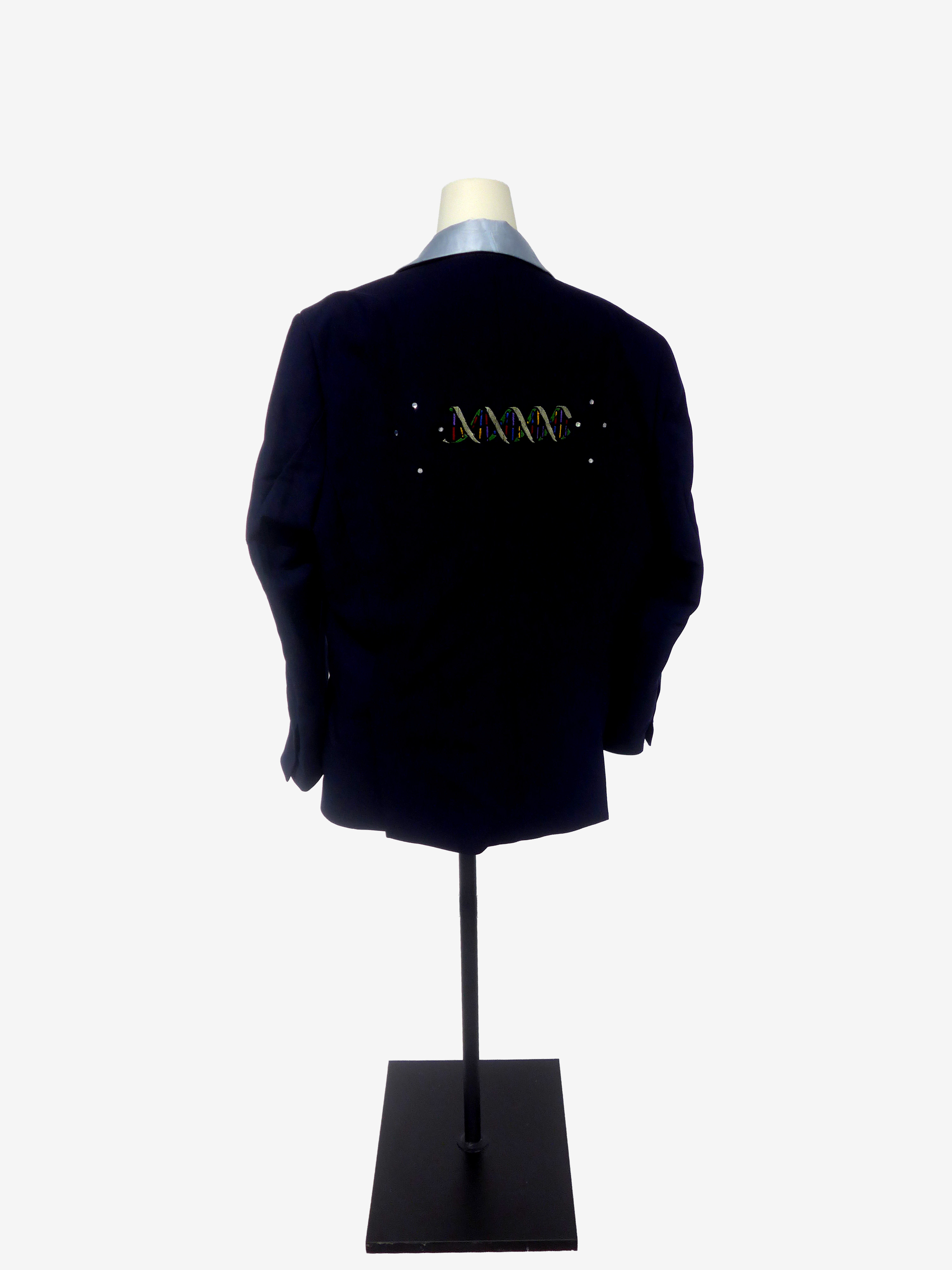 A DNA double helix embroidered across the back of the jacket
