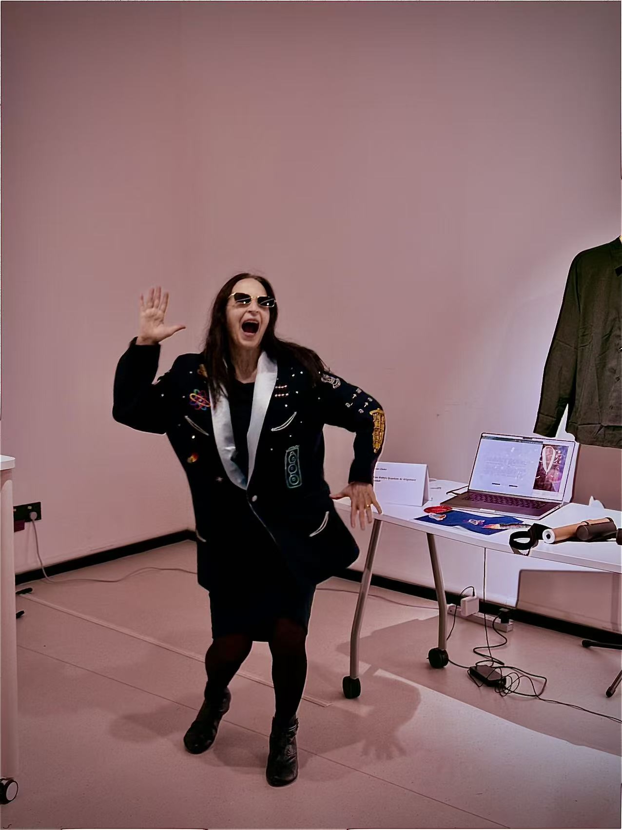Margaret Minsky wearing the jacket, arms raised